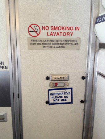 No vaping sign airplane lavatory airport gate sensor detection - The No-Bathroom Flight | Webner House